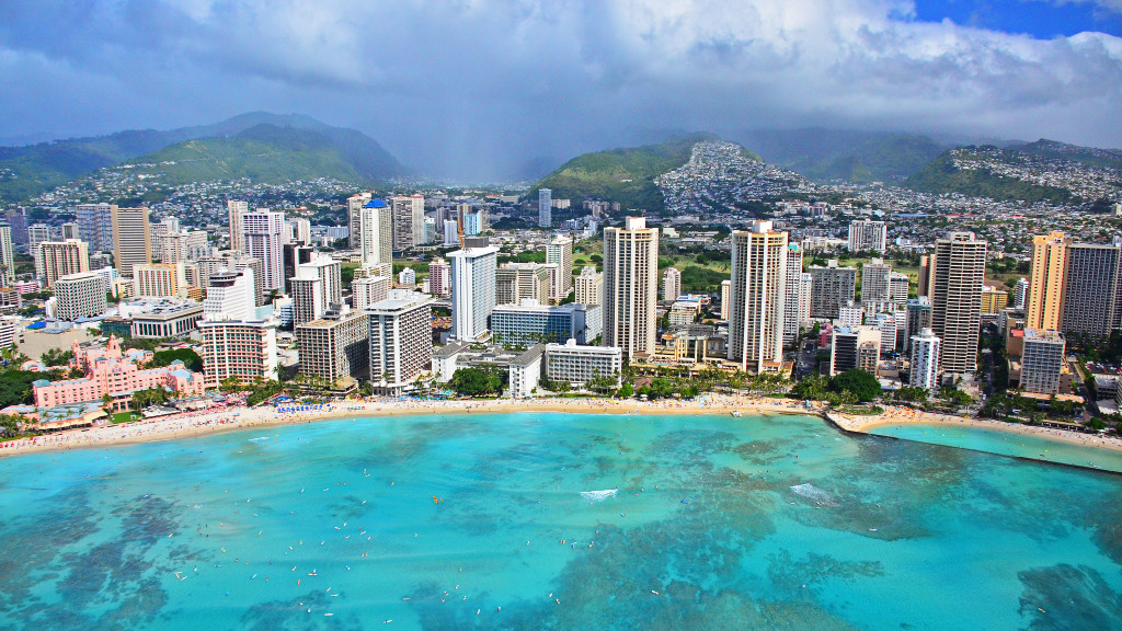 Above: Waikiki beach photographed from a Genesis Aviation Helicopter tour. Much of Hawaii’s economy is reliant on tourism and hospitality.Image Credit: Edmund Garman/Flickr